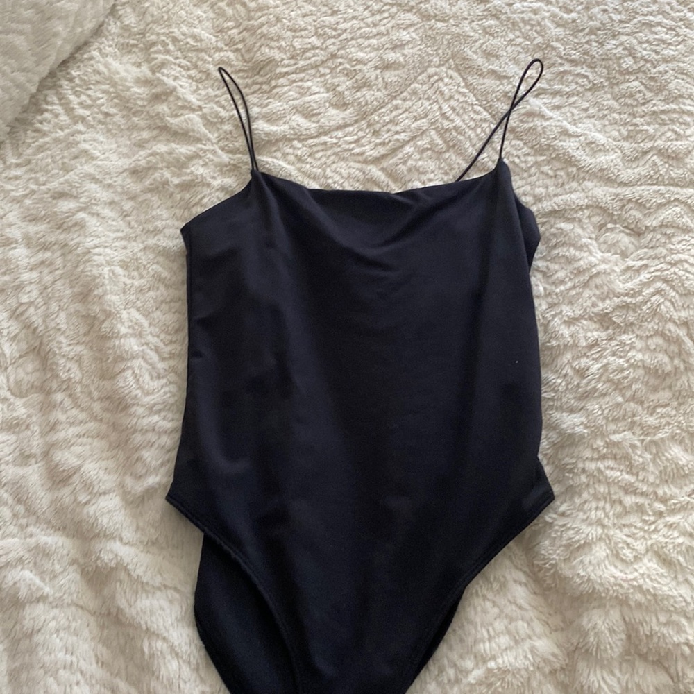 Small black silky bodysuit! Super comfy and flattering